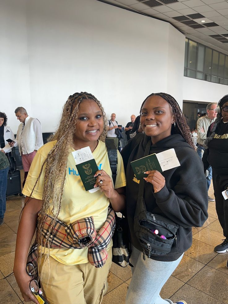 Travellers holding passports at the airport